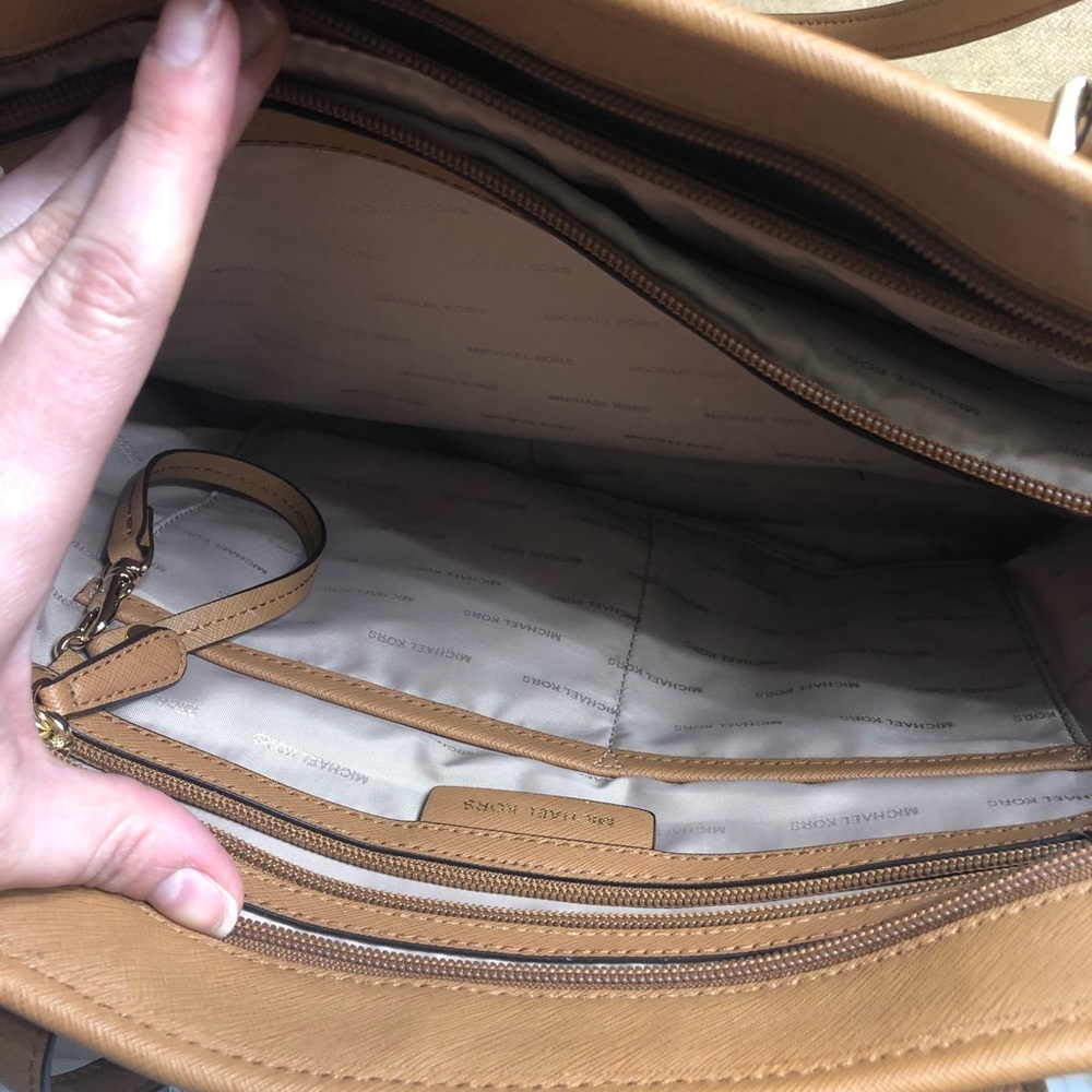 Michael Kors Jet Set Travel Tote with zip closure.